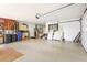 Spacious garage with overhead storage and ample room for parking and projects at 6640 Peacock Rd, Sarasota, FL 34242