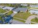 Aerial view of a single-Gathering home showcasing the home and surrounding green lawn at 6716 Keystone Dr, Sarasota, FL 34231