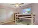 Bedroom features white bunk beds, a window and light pink walls at 6716 Keystone Dr, Sarasota, FL 34231