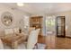 Cozy dining area with a modern table, upholstered chairs, and a view of the bedroom at 6716 Keystone Dr, Sarasota, FL 34231