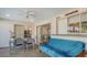 Relaxing sunroom featuring a ceiling fan, dining table and a futon at 6716 Keystone Dr, Sarasota, FL 34231