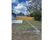 Large backyard with a new wooden fence and concrete slab at 7109 Java Dr, Sarasota, FL 34241