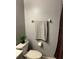 Neutral bathroom features a decorative towel, toilet, and faux plant for added charm at 7109 Java Dr, Sarasota, FL 34241