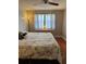 Bedroom featuring ceiling fan and large window with dresser at 7109 Java Dr, Sarasota, FL 34241