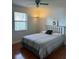 Bedroom featuring a large window with ceiling fan at 7109 Java Dr, Sarasota, FL 34241