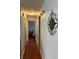 Hallway with barn door and decorative accent at 7109 Java Dr, Sarasota, FL 34241