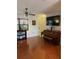 Inviting living room showcasing hardwood floors, a ceiling fan, and a piano at 7109 Java Dr, Sarasota, FL 34241