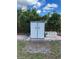 Outdoor shed with foliage and a pile of concrete blocks at 7109 Java Dr, Sarasota, FL 34241