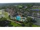 Aerial shot showcasing a community pool with inviting lounge chairs and well-maintained landscaping at 7140 Marsh View Ter, Bradenton, FL 34212