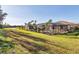 Backyard view showcasing a covered pool and spa at 7140 Marsh View Ter, Bradenton, FL 34212