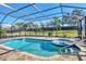 Enclosed pool area featuring a spa and tile floors at 7140 Marsh View Ter, Bradenton, FL 34212