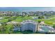 Aerial view of a condo complex with golf course and pool, highlighting the community's amenities at 775 Longboat Club Rd # 406, Longboat Key, FL 34228