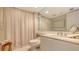 Bathroom featuring tiled shower and marble countertops at 775 Longboat Club Rd # 406, Longboat Key, FL 34228