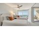 Bright bedroom with two beds and balcony access with ocean view at 775 Longboat Club Rd # 406, Longboat Key, FL 34228