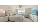 This spacious bedroom features beach views and an open floor plan at 775 Longboat Club Rd # 406, Longboat Key, FL 34228