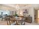 Elegant dining area with modern light fixture and mirrored wall accents at 775 Longboat Club Rd # 406, Longboat Key, FL 34228