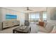 Living room boasts ocean views, comfortable seating, and modern furnishings at 775 Longboat Club Rd # 406, Longboat Key, FL 34228