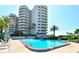 Large pool with building in the background at 775 Longboat Club Rd # 406, Longboat Key, FL 34228