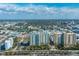 An aerial view of a high-rise condominium complex, in a vibrant city setting with ample neighborhood amenities at 800 N Tamiami Trl # 1217, Sarasota, FL 34236