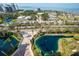 Stunning aerial view showcasing the community, the bay and the lush landscaping surrounding the property at 800 N Tamiami Trl # 1217, Sarasota, FL 34236