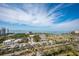 Breathtaking aerial view of the community, the city, and the bay with lush landscaping at 800 N Tamiami Trl # 1217, Sarasota, FL 34236