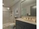 Well-lit bathroom featuring a vanity, shower, and toilet with modern fixtures at 800 N Tamiami Trl # 1217, Sarasota, FL 34236