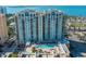 Stunning high-rise condo featuring a pool, gorgeous architecture, and waterfront views at 800 N Tamiami Trl # 1217, Sarasota, FL 34236