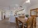 This dining area features an open floor plan, with views into the kitchen at 8414 Wethersfield Run # 102, Lakewood Ranch, FL 34202