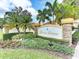 The Boca Grove stone and stucco sign is surrounded by manicured landscaping at 8414 Wethersfield Run # 102, Lakewood Ranch, FL 34202