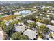 Aerial view of the community showcasing the lake and residential housing at 905 Barclay Ct, Venice, FL 34293