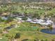 A resort-style community with lush landscaping, and golf course, and a club with tennis at 905 Barclay Ct, Venice, FL 34293