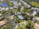 Aerial view of a community featuring landscaping, single-Gathering homes, and a community pool at 905 Barclay Ct, Venice, FL 34293