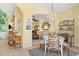 Dining area featuring a chandelier and an open view of the living room at 905 Barclay Ct, Venice, FL 34293