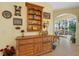 Dining area with a wooden hutch and views of the lanai at 905 Barclay Ct, Venice, FL 34293