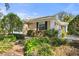 Charming exterior of a home showcasing manicured landscaping and classic architectural design at 905 Barclay Ct, Venice, FL 34293