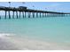 Picturesque scene of the Venice Fishing Pier stretching over the clear turquoise water at 905 Barclay Ct, Venice, FL 34293