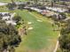 Beautiful golf course featuring lush green fairways, sand traps, and serene ponds at 905 Barclay Ct, Venice, FL 34293