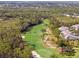 Scenic golf course view with lush fairways, mature trees, and well-manicured landscaping at 905 Barclay Ct, Venice, FL 34293