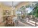 Bright dining area with outdoor patio access at 905 Barclay Ct, Venice, FL 34293