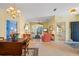 Bright, inviting living room with tile floors, open layout, and views to the outside patio at 905 Barclay Ct, Venice, FL 34293