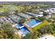 Aerial view of the community's pickleball courts with bright colors and lush landscaping at 905 Barclay Ct, Venice, FL 34293