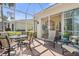 Enjoy outdoor living on this screened patio with comfortable seating and bright natural light at 905 Barclay Ct, Venice, FL 34293