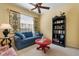 Cozy sitting room with comfortable sofa, window with blinds, and decorative accents at 905 Barclay Ct, Venice, FL 34293