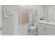 Bathroom featuring tub, tile, seashell decor, and white vanity at 10470 Spring Tide Way, Parrish, FL 34219