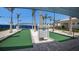 Bocce ball court under shade, landscaped with palm trees, featuring a well-maintained playing surface at 10470 Spring Tide Way, Parrish, FL 34219