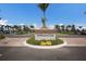 Elegant Driftwood Club entrance sign surrounded by manicured landscaping and palm trees at 10470 Spring Tide Way, Parrish, FL 34219