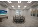 Bright conference room features a large table, comfortable seating, and a wall-mounted television for presentations at 10470 Spring Tide Way, Parrish, FL 34219