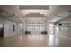 Expansive fitness room with ceiling fans, multiple windows, and mirrored walls at 10470 Spring Tide Way, Parrish, FL 34219