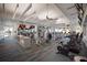 Well-equipped gym with modern fitness machines, televisions, and bright lighting for a great workout experience at 10470 Spring Tide Way, Parrish, FL 34219