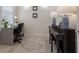 Home office featuring desk, piano, shutters and beach-themed artwork at 10470 Spring Tide Way, Parrish, FL 34219
